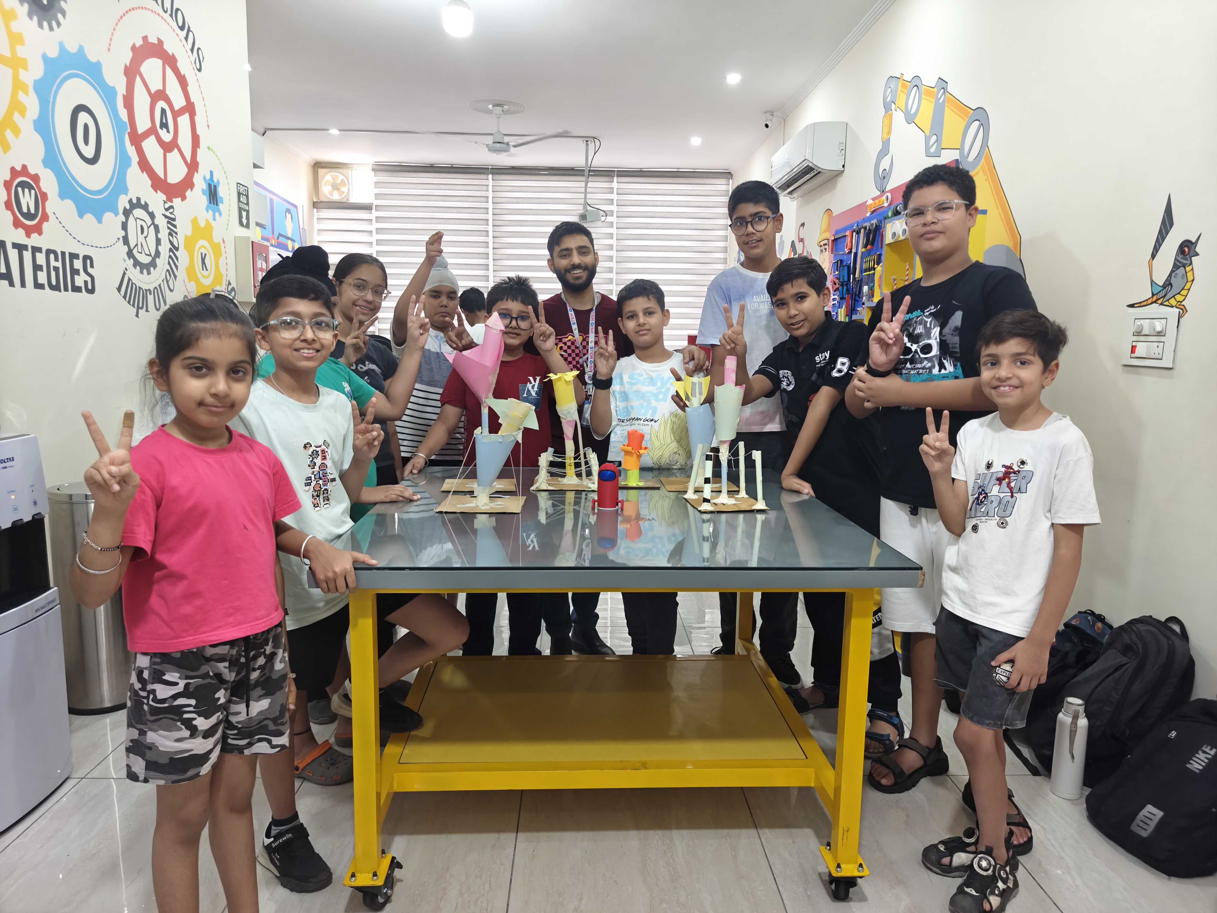 Children working with robotics kits at camp